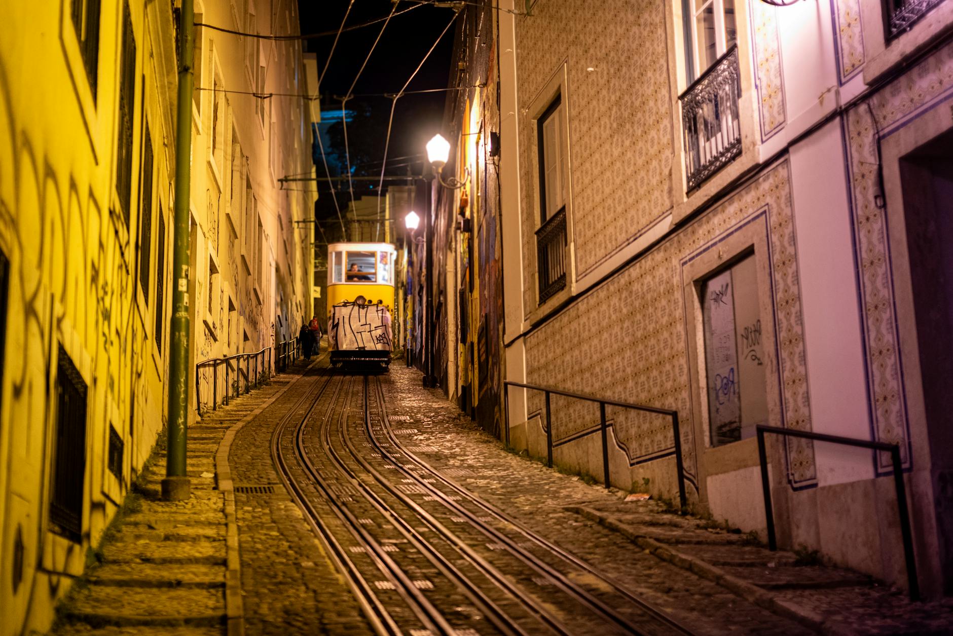 Bairro Alto street at evening with people gathered outside small bars