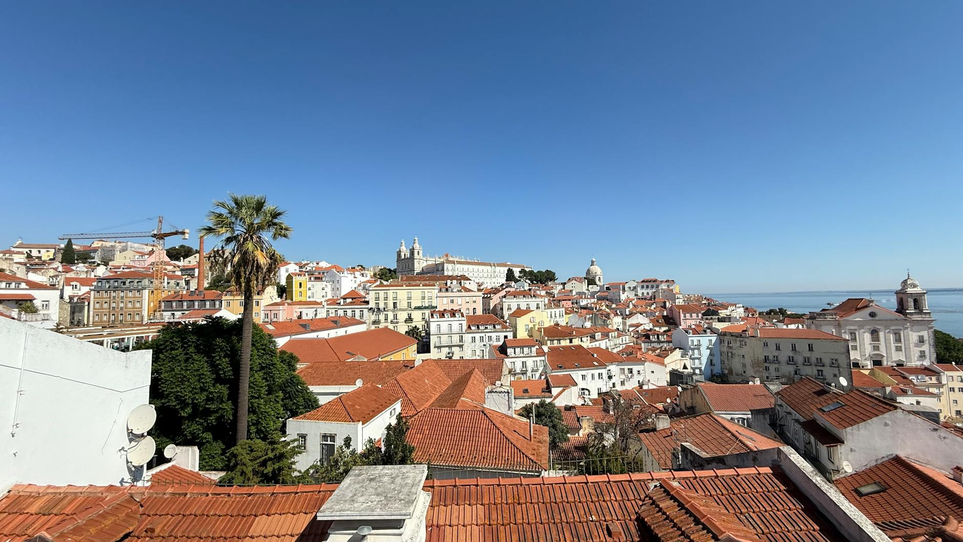 Alfama neighborhood colorful rooftops and narrow streets in Lisbon