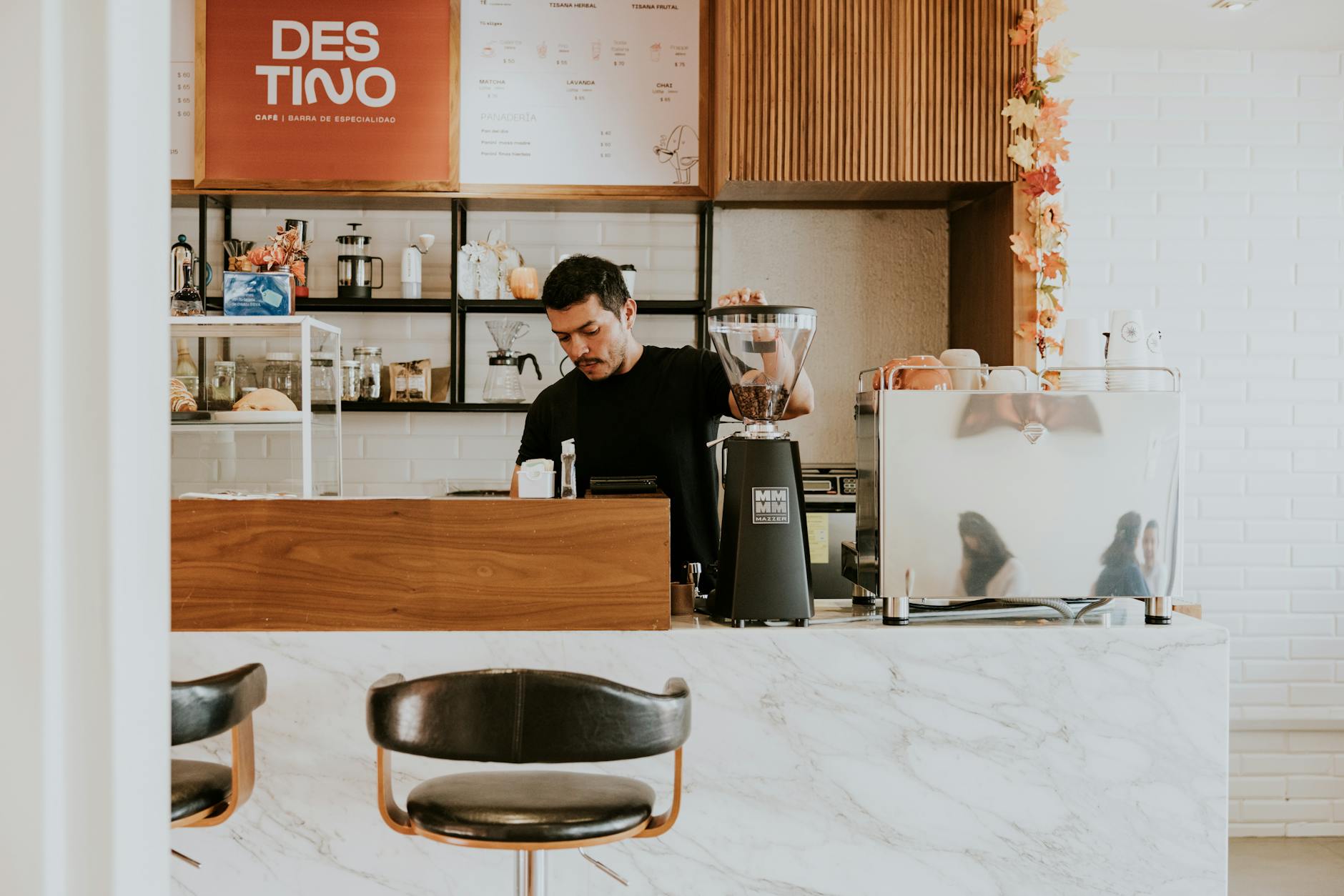 Espresso bica being served on a marble counter at a traditional Lisbon café