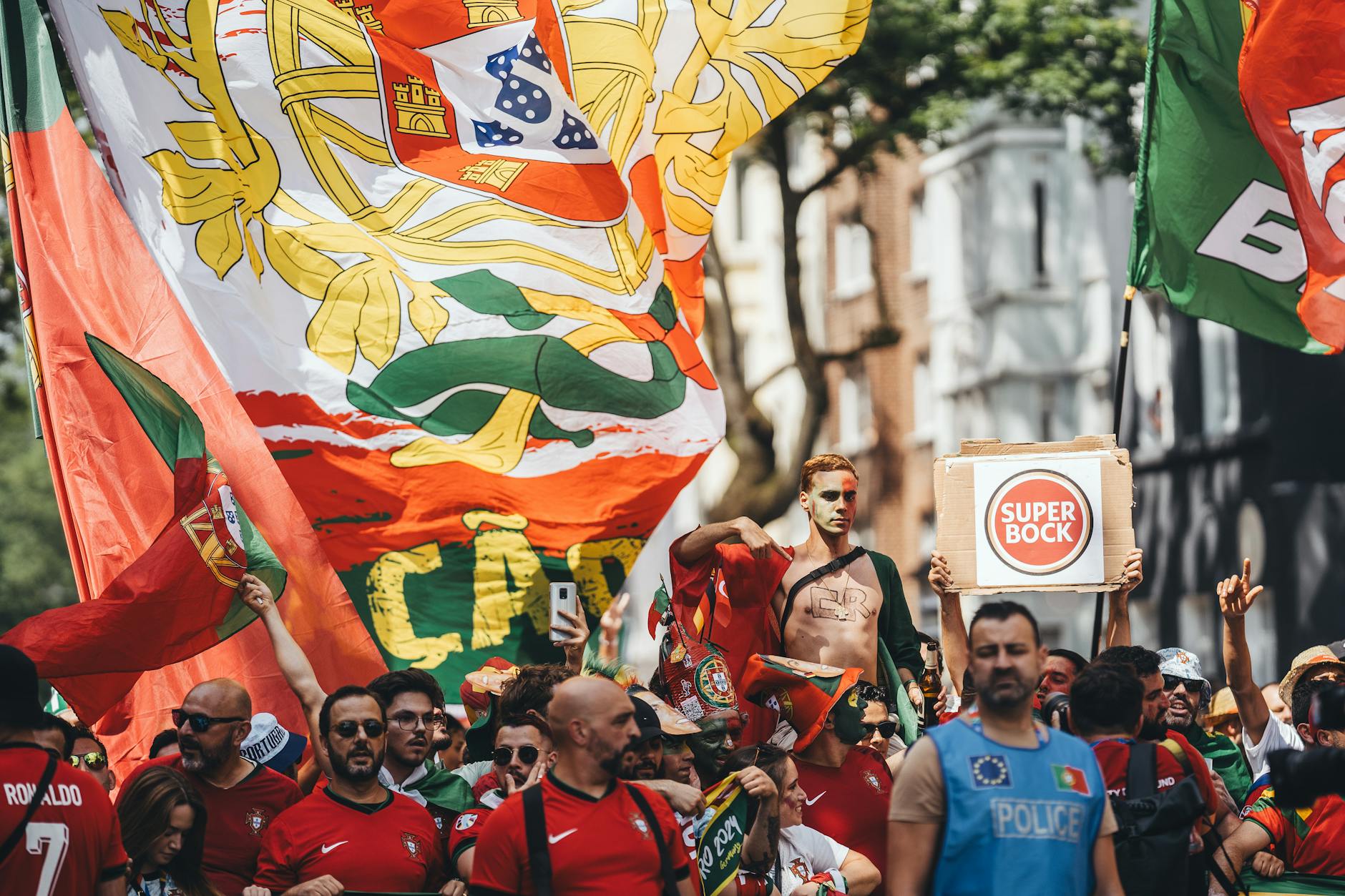Lively Festas dos Santos Populares street party in Alfama with colorful decorations and crowds