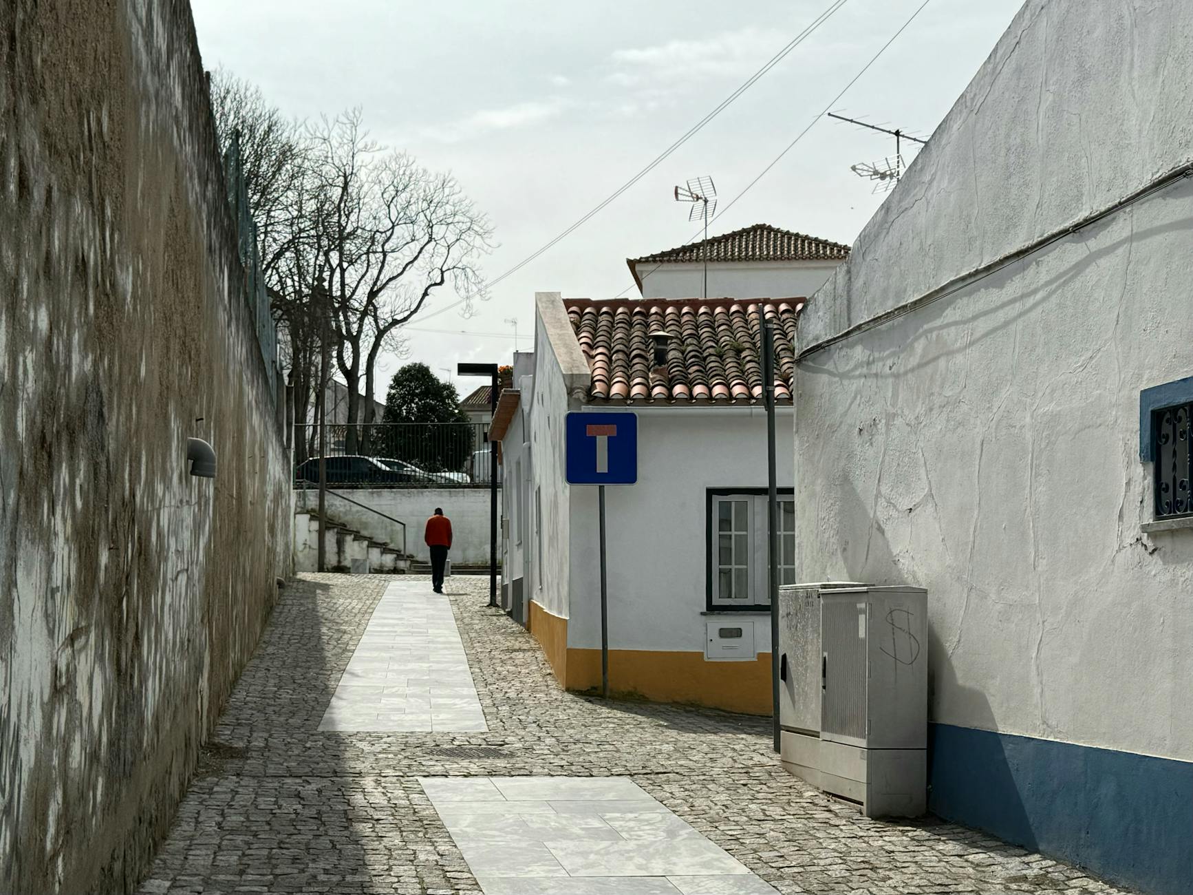 Quiet narrow tile-decorated street in Lisbon's Graça neighborhood with no tourists