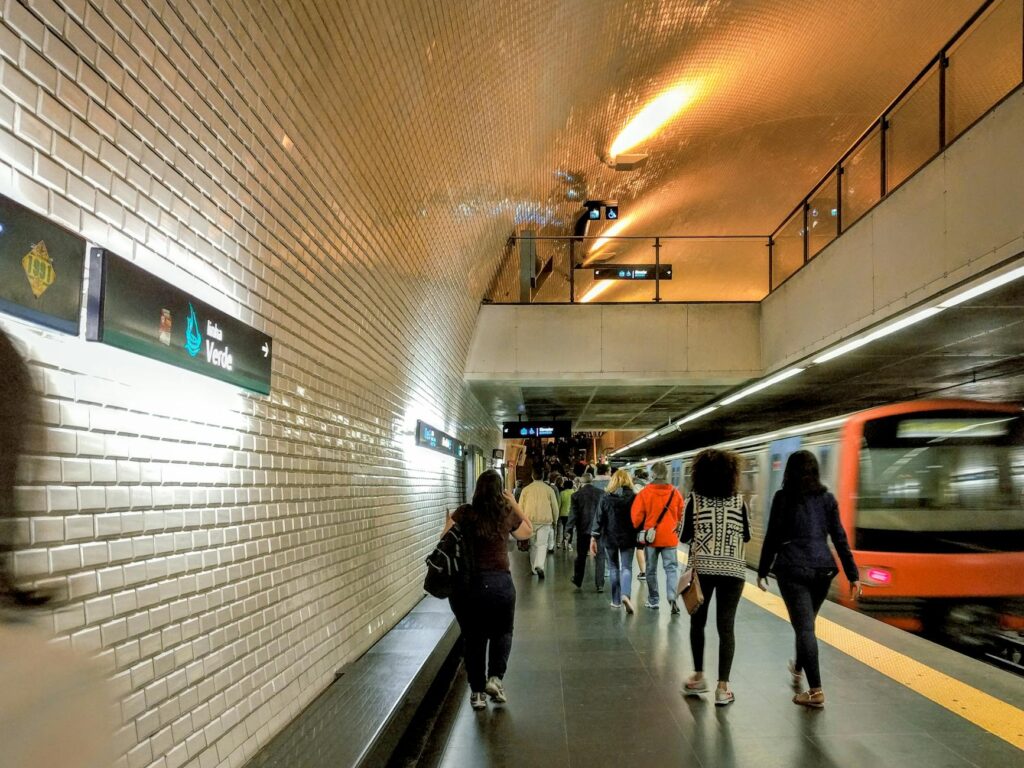 Commuters on a Lisbon Metro subway platform - the city's efficient public transport system