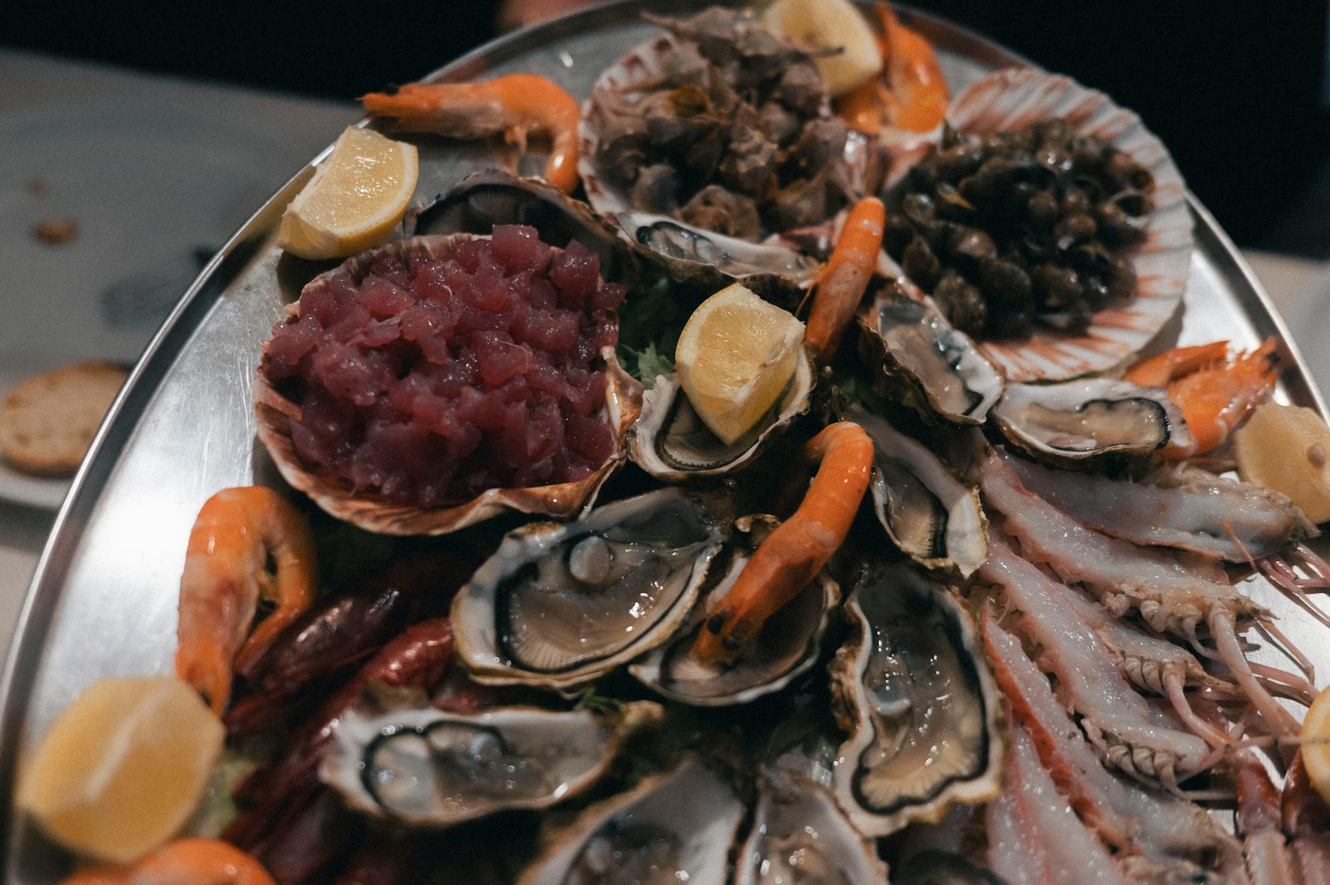 Fresh Portuguese seafood platter with prawns clams and grilled fish in Lisbon restaurant