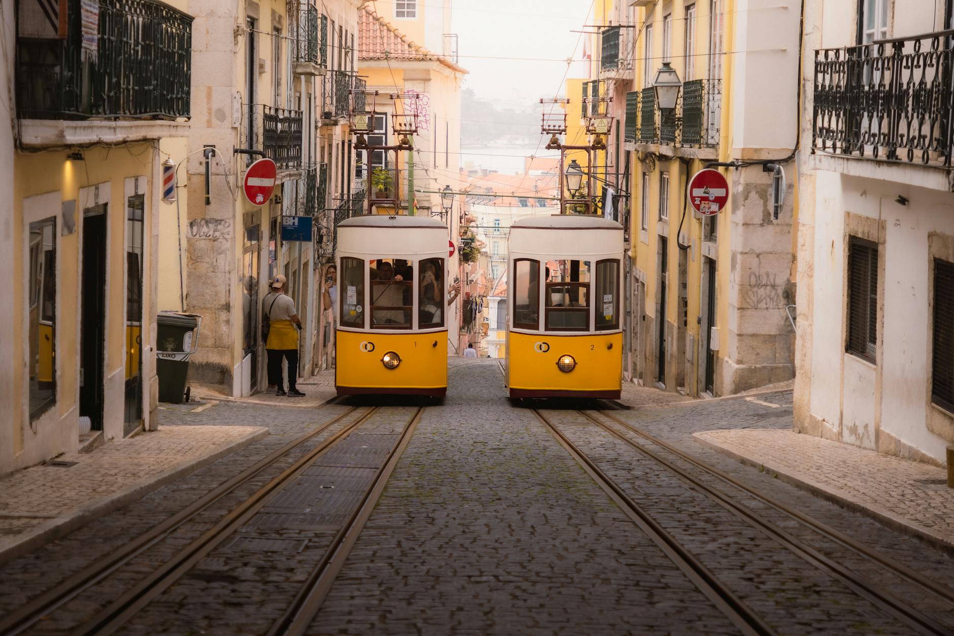 Historic yellow tram on Lisbon streets with practical travel information