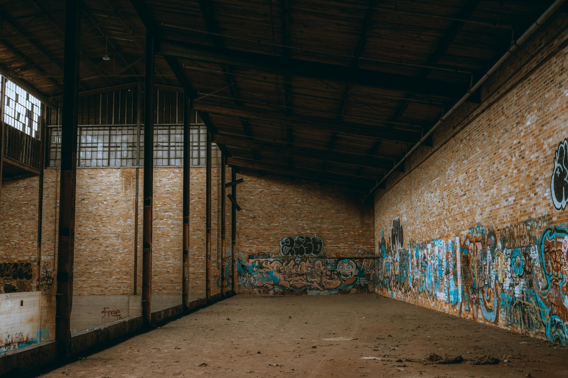Industrial brick buildings and street art at LX Factory creative complex in Lisbon
