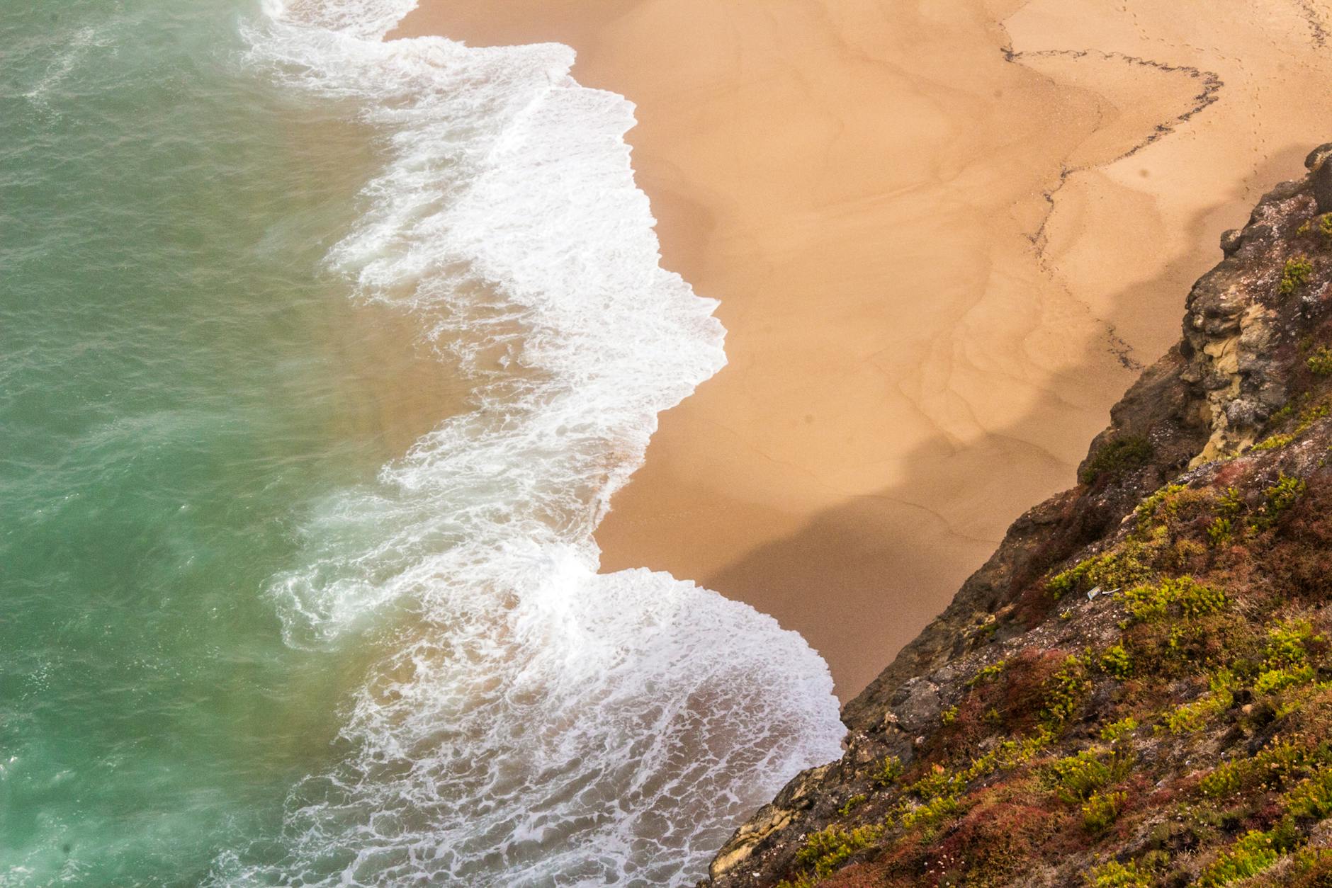 Nazaré beach and cliffs Portugal famous for big wave surfing