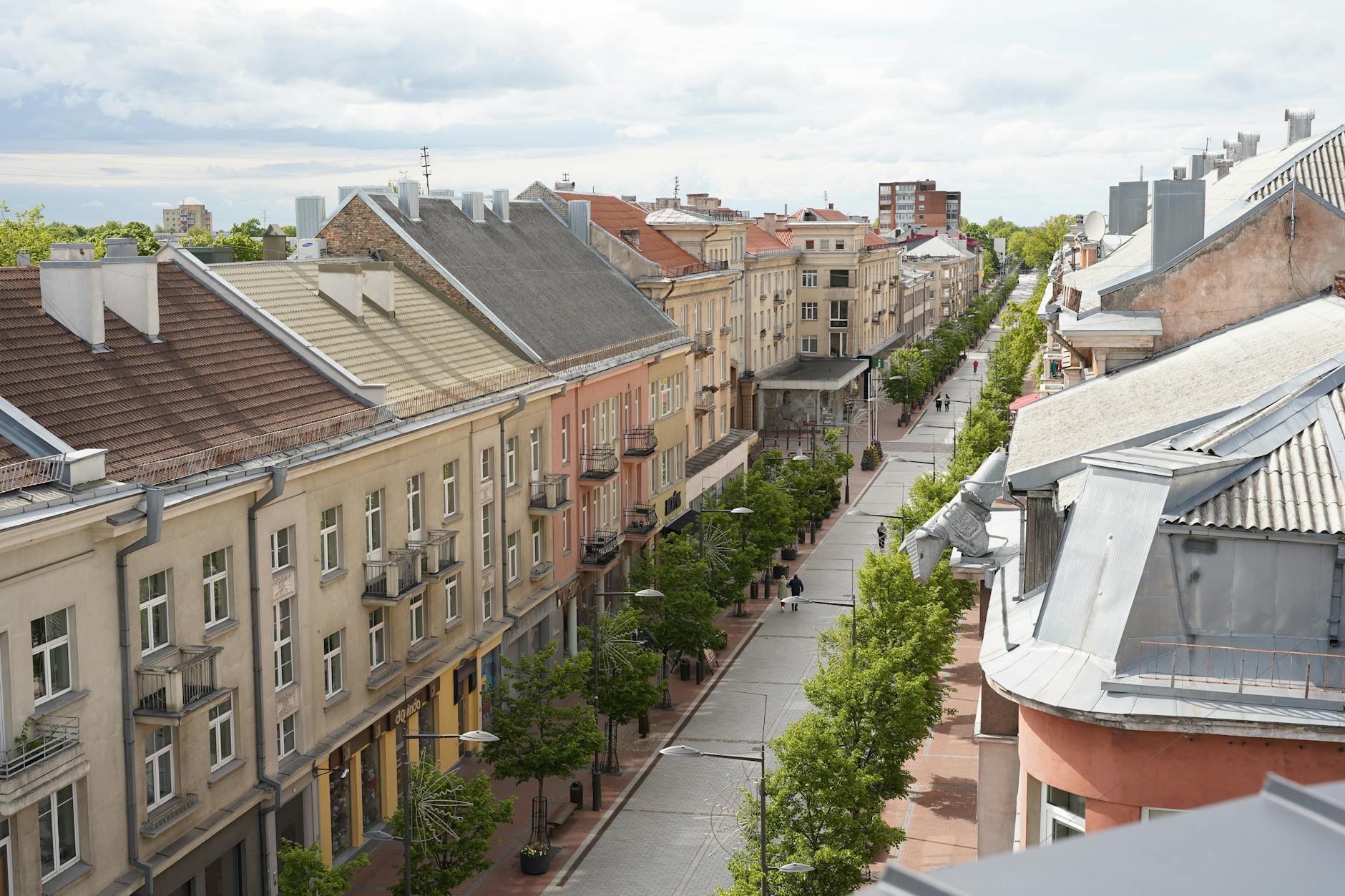 Tree-lined Avenida da Liberdade with luxury shops and 19th-century buildings in Lisbon