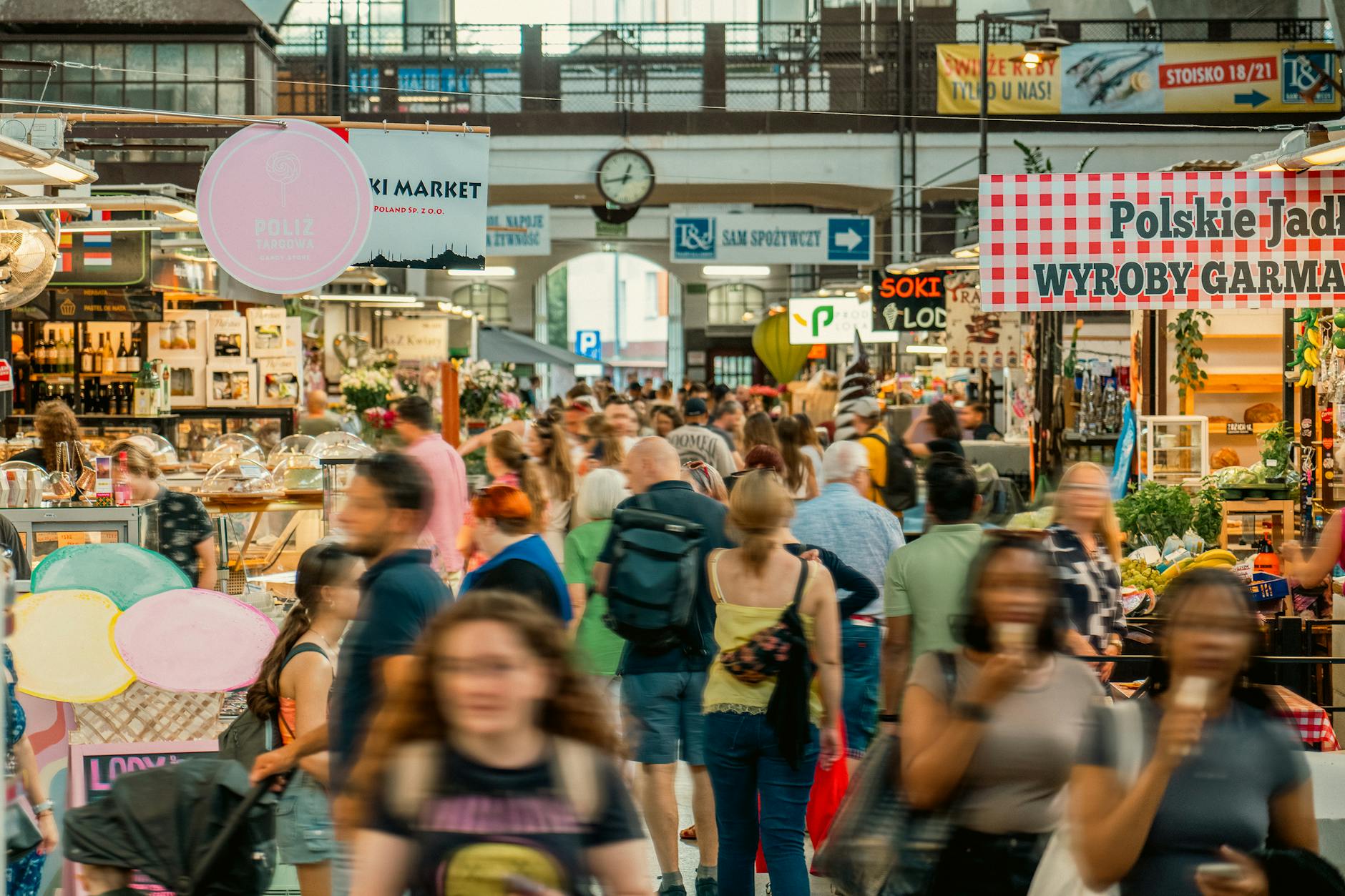Bustling food hall with communal wooden tables and food stalls at Time Out Market Lisbon