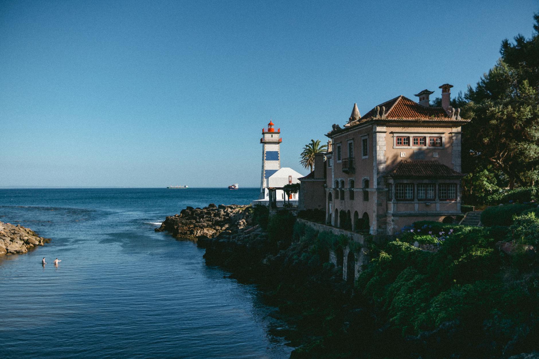 Cascais coastline with Santa Maria lighthouse and historic seafront buildings