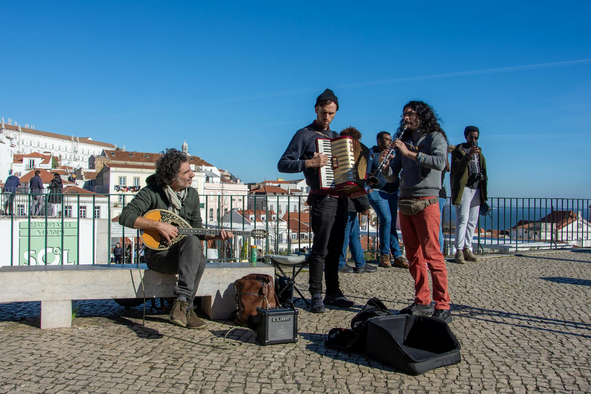 Street musicians performing in Lisbon Alfama