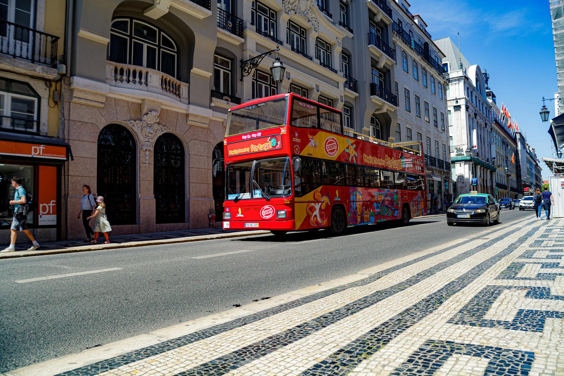 Colorful city tour bus sightseeing on Lisbon street
