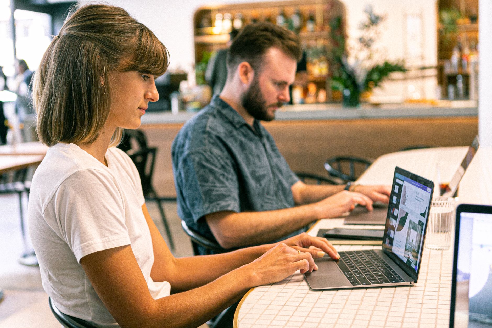 Digital nomads working together in a modern Lisbon coworking space