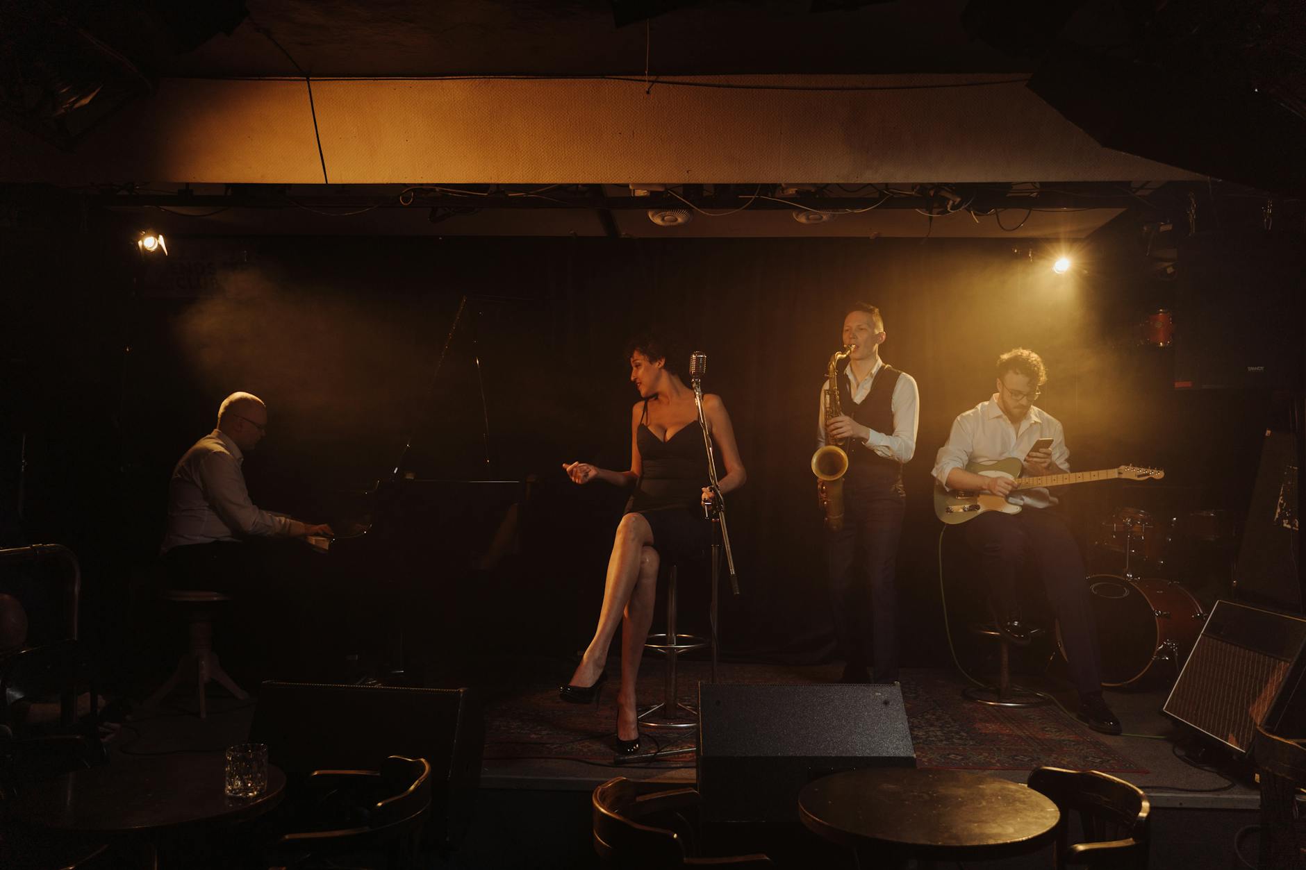 Jazz band with female vocalist, piano and saxophone performing at Lisbon music venue