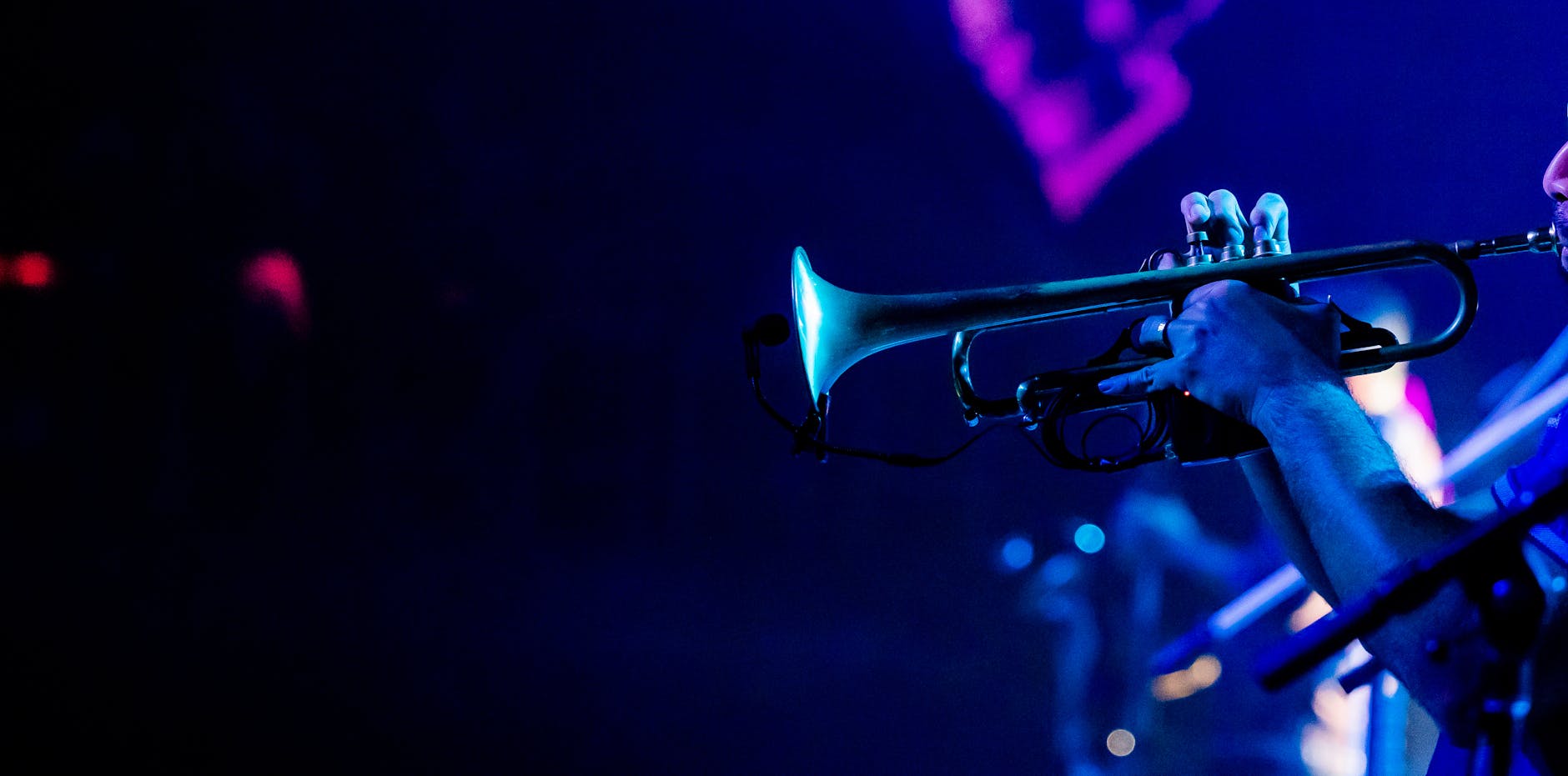Jazz trumpeter performing at intimate live music venue in Lisbon