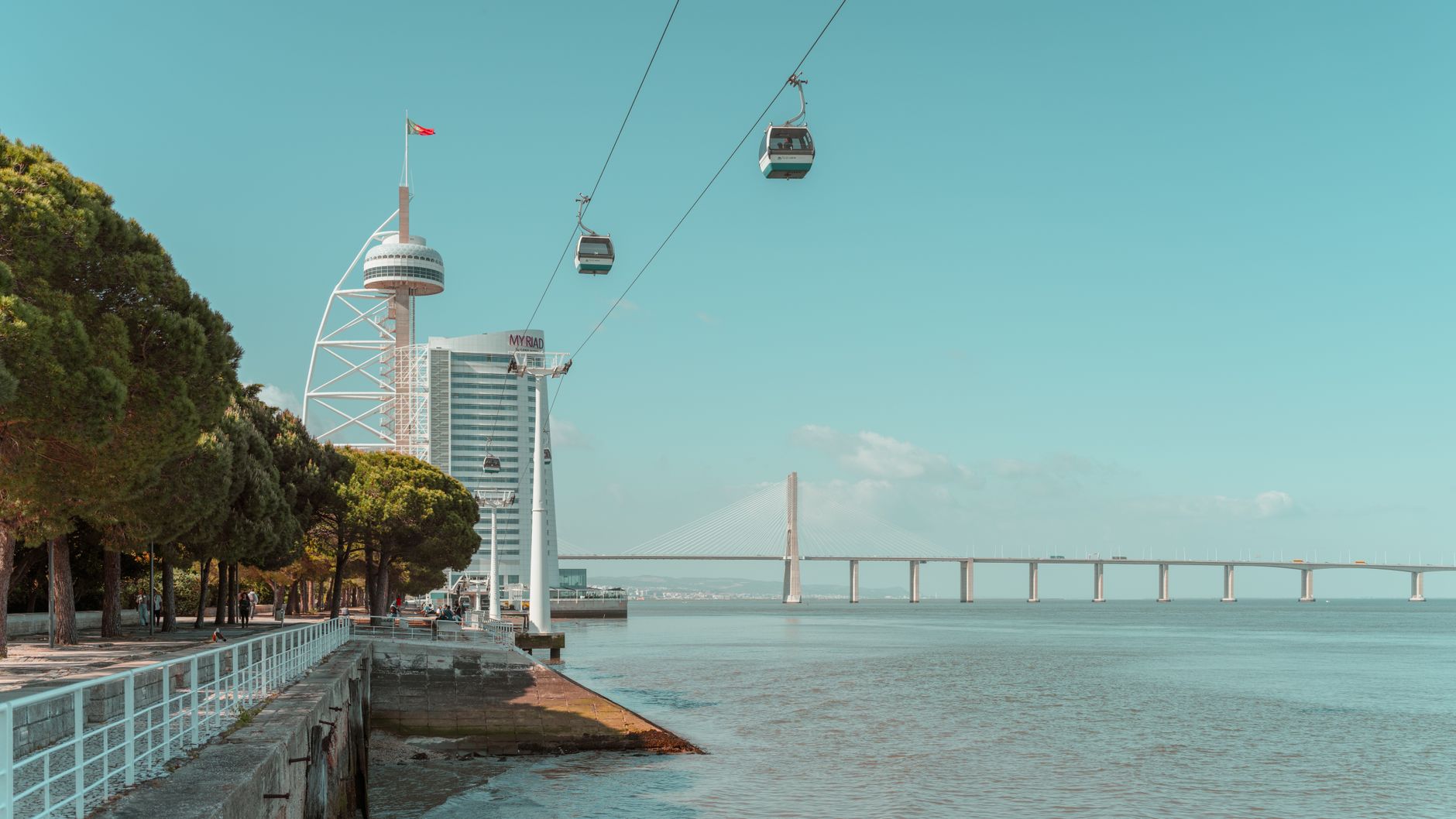 Lisbon cable car in Parque das Nações with Vasco da Gama Tower and Tagus River