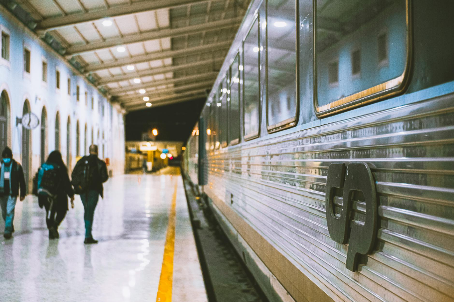 Passengers at Lisbon Santa Apolónia train station — trains are the fastest way to reach Belém and Cascais