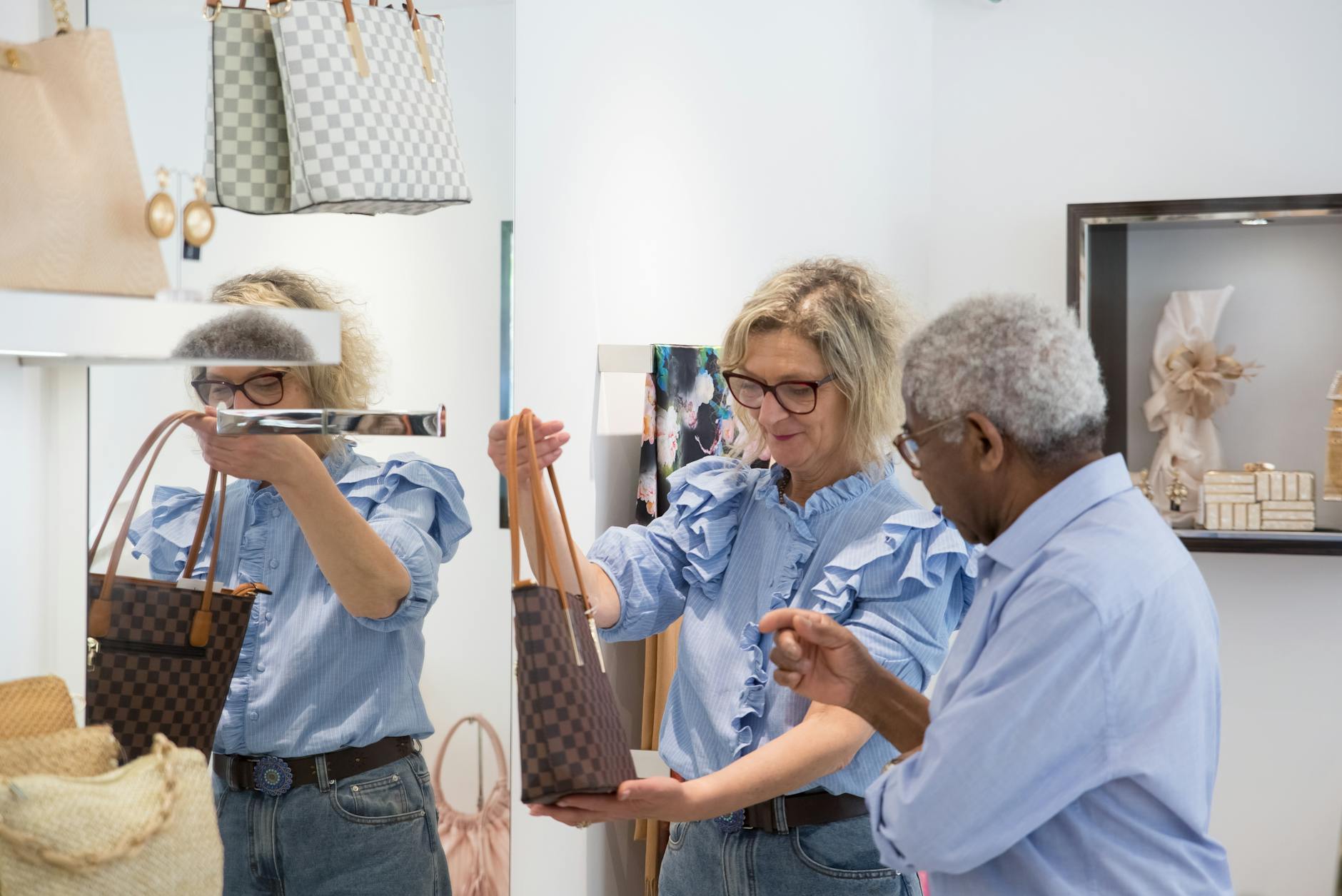Shoppers browsing bags inside a Portugal boutique in Lisbon