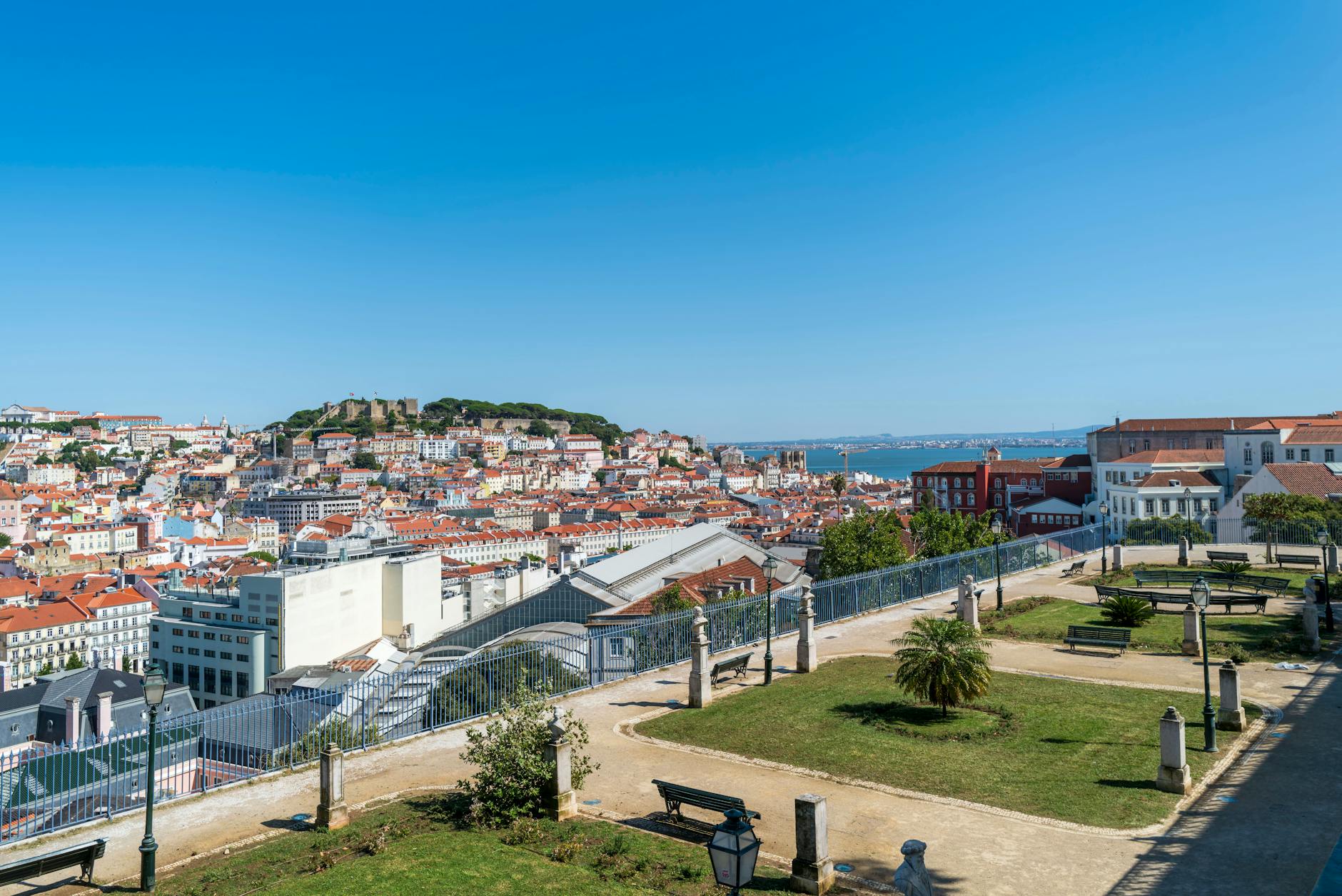 Elevated view of Lisbon skyline and São Jorge Castle, with the Pombaline Baixa grid below