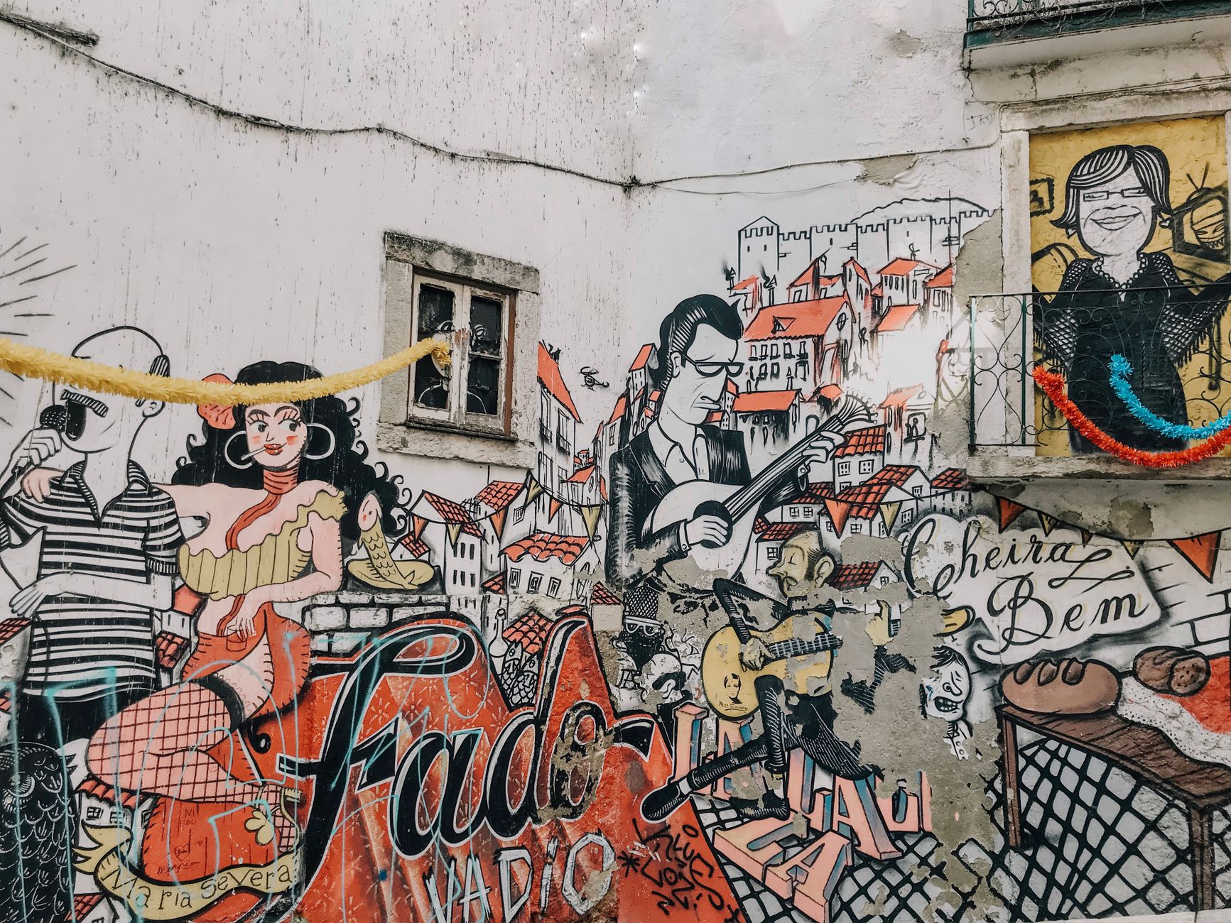 Vibrant street art depicting fado culture in Alfama Lisbon free to see