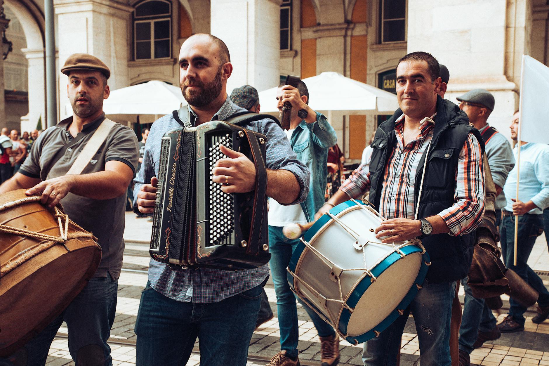 Street band playing accordion and drums at Lisbon festival celebration