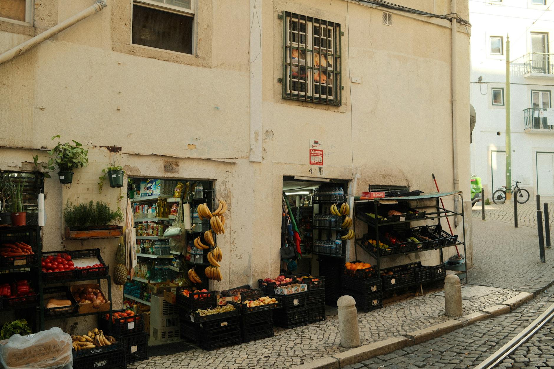 Lisbon street market with fresh vegetables and produce displayed outdoors