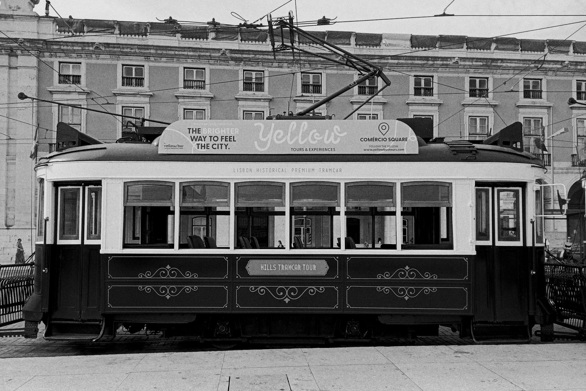 Vintage Lisbon tram at Praça do Comércio square on a clear day