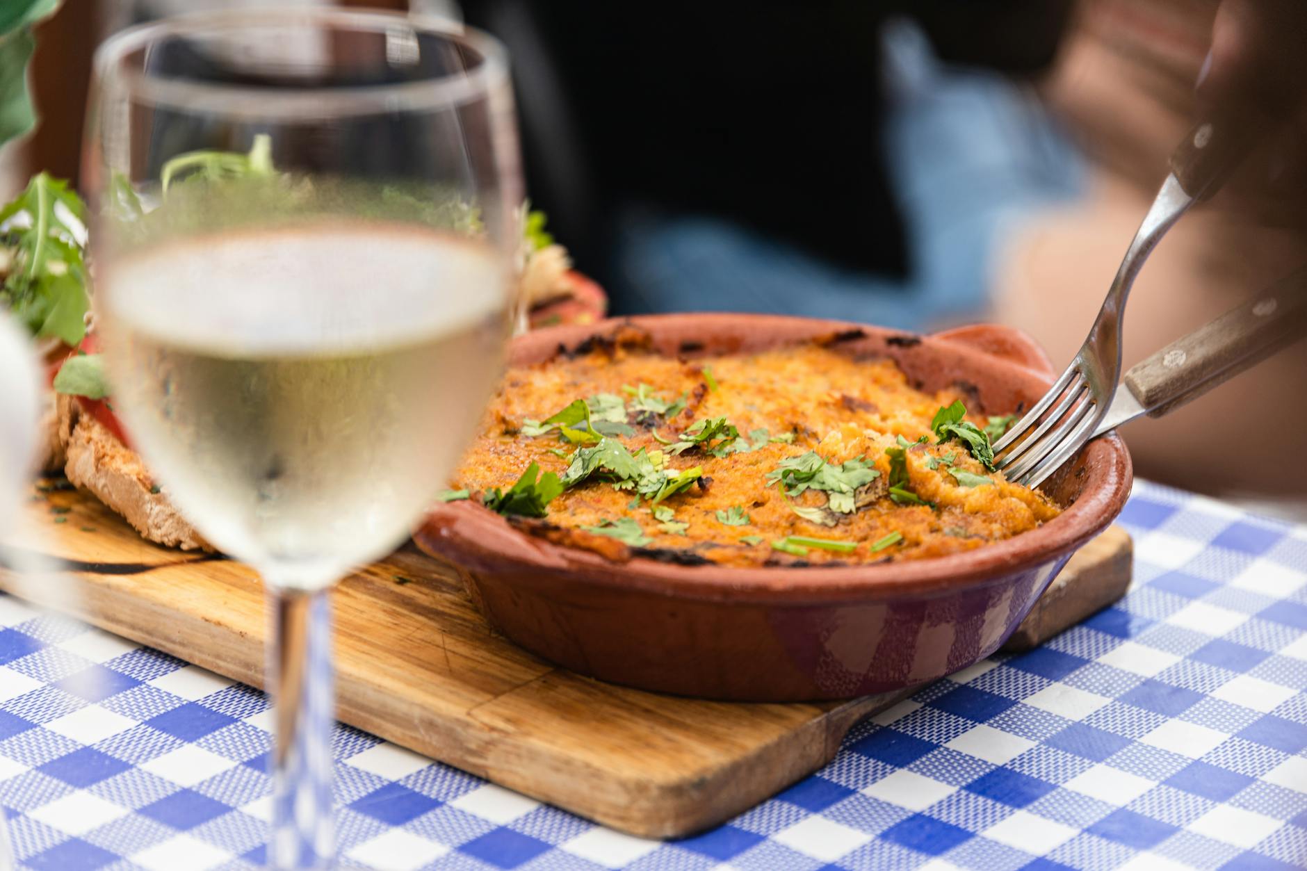 Traditional Portuguese dish served with white wine in a Lisbon restaurant