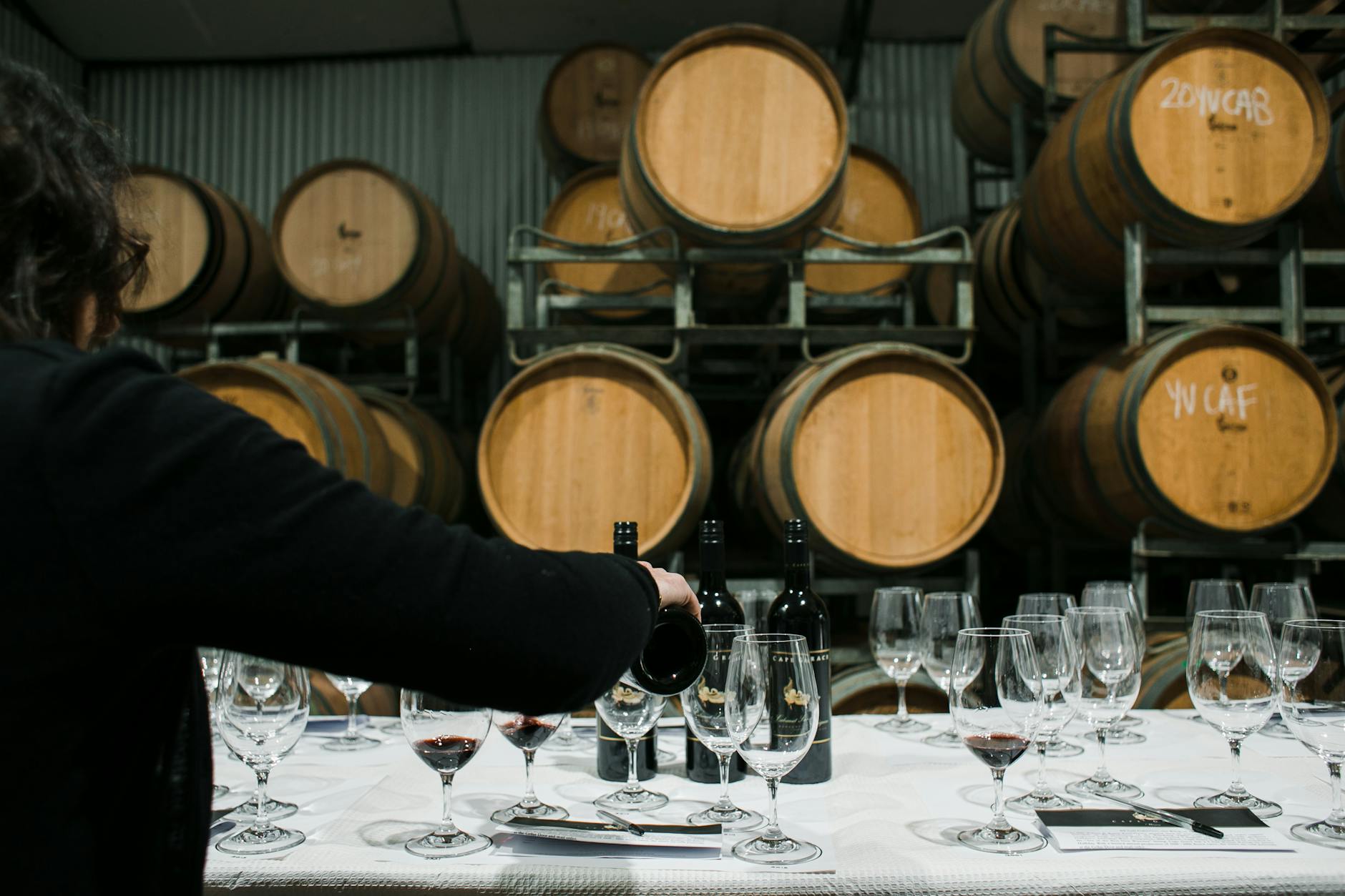Sommelier pouring Portuguese wine for a tasting in a wine bar