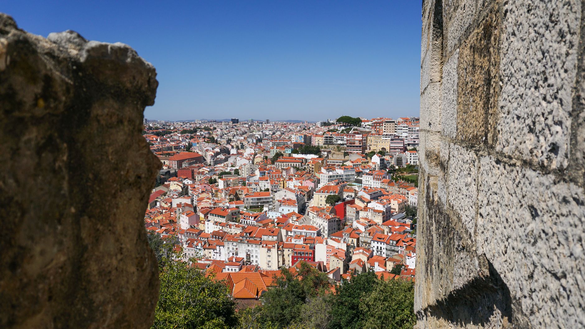 View from São Jorge Castle ramparts over Lisbon red rooftops