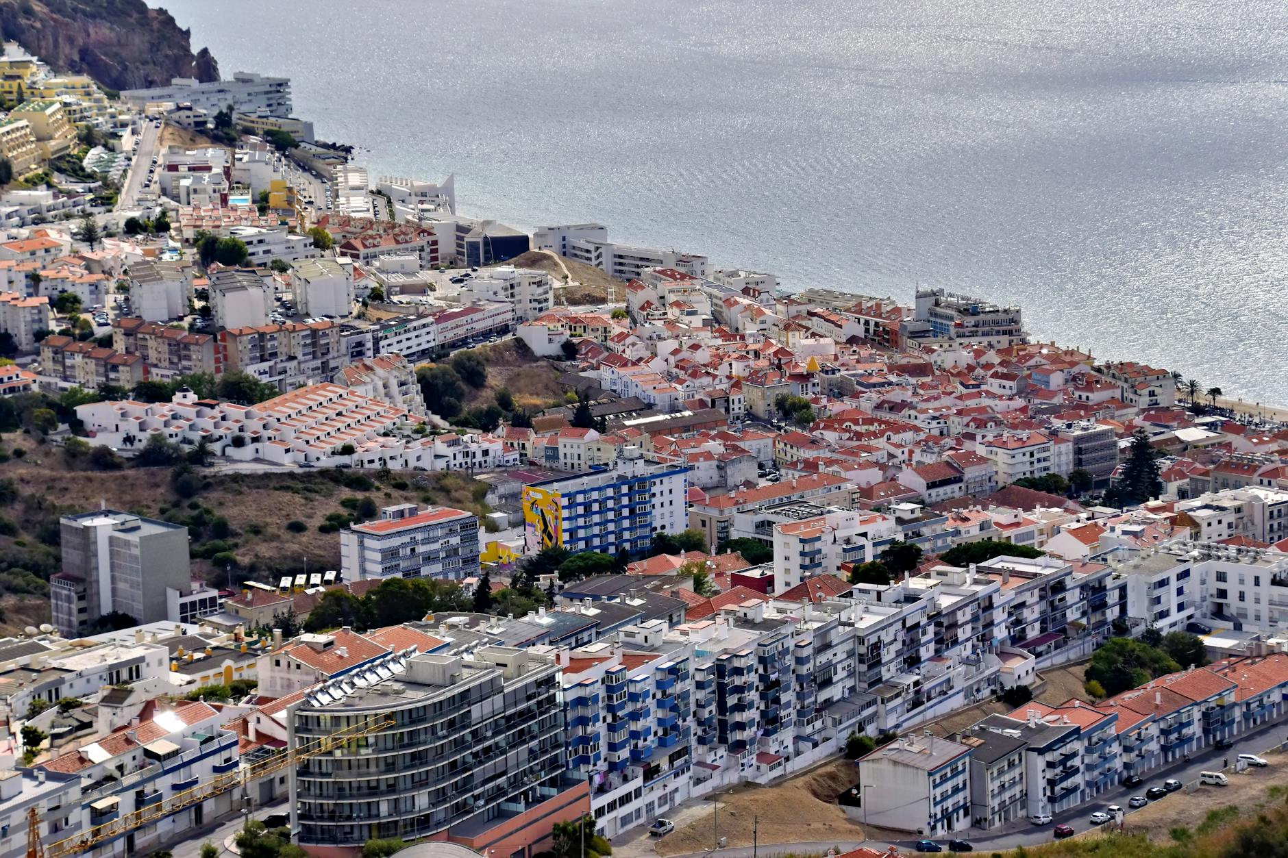 Aerial view of Sesimbra coastal architecture and shoreline Portugal