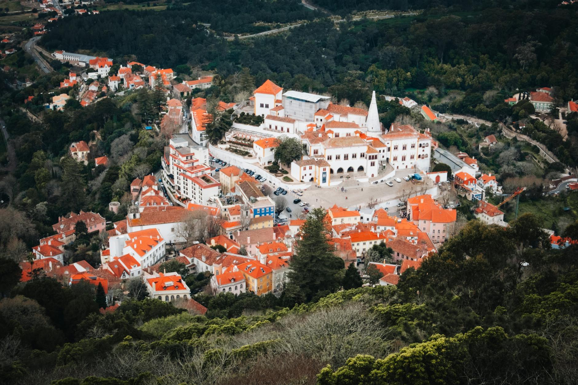 Aerial view of Sintra National Palace with its distinctive twin chimneys and historic town below