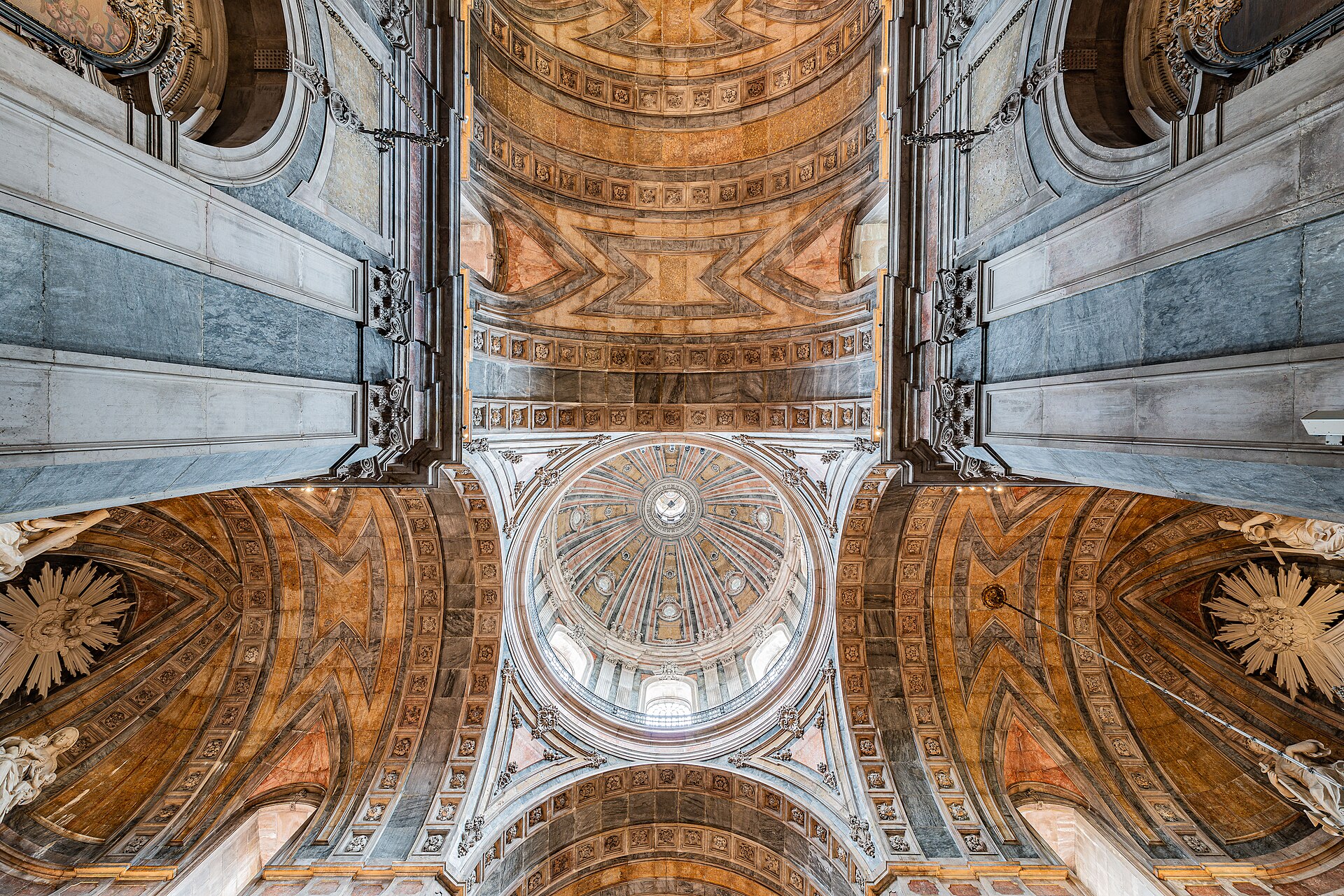 The coloured marble vault and dome of the Basílica da Estrela seen from directly below