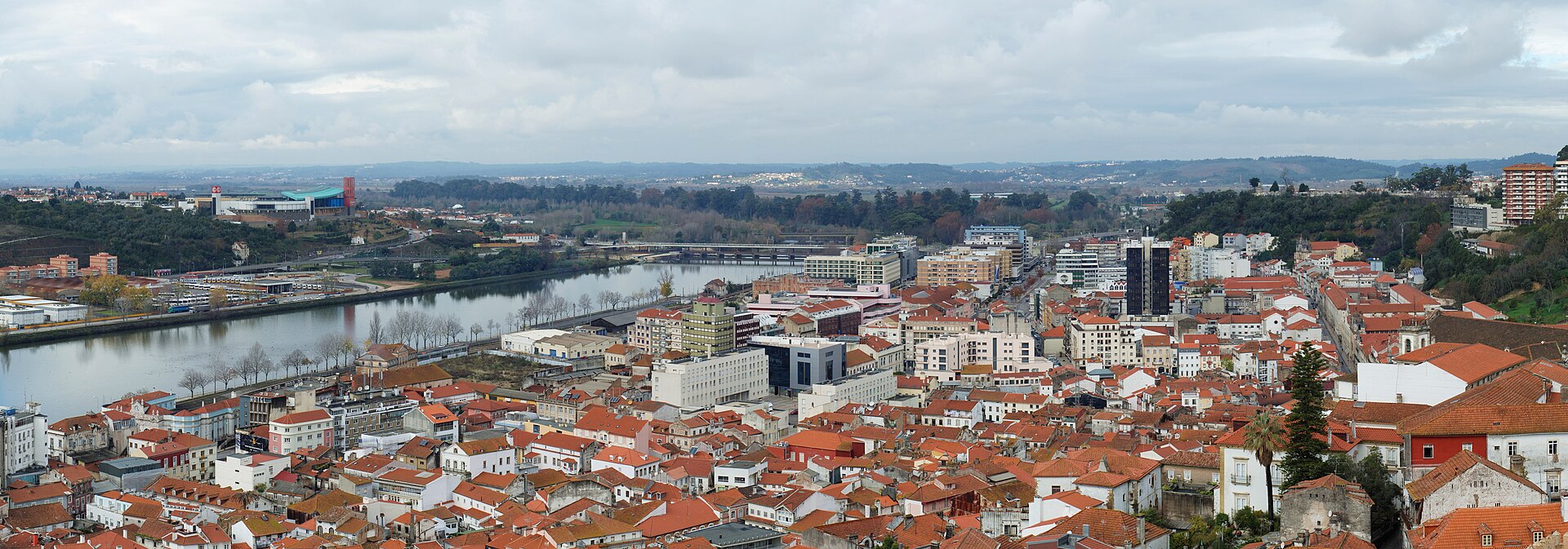 Panoramic view over Coimbra's rooftops and the Mondego river from the university hill
