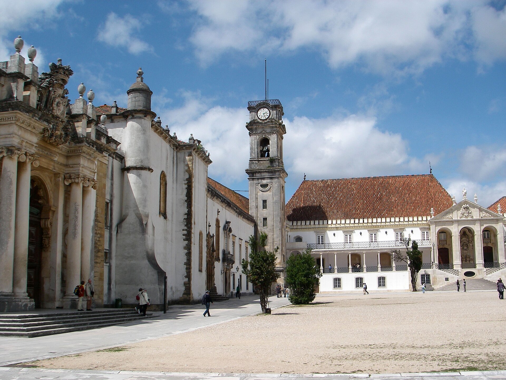The courtyard of the Paço das Escolas at the University of Coimbra with the clock tower and the Via Latina colonnade