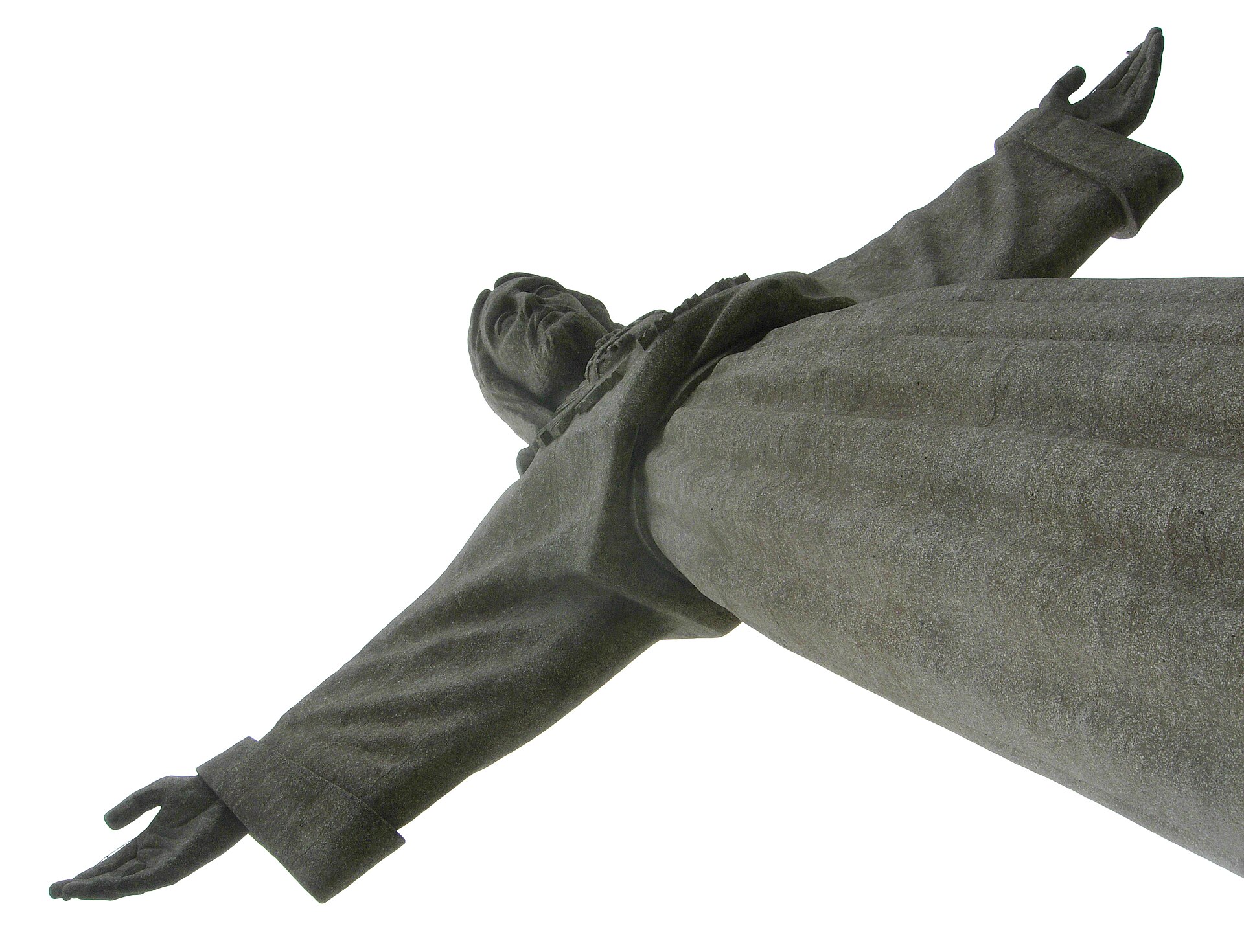The Cristo Rei statue in Almada seen from directly below, arms outstretched against the sky