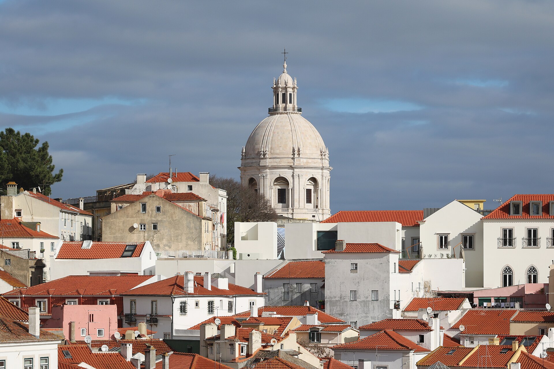The white dome of the Panteao Nacional rising above the red rooftops of Alfama in Lisbon