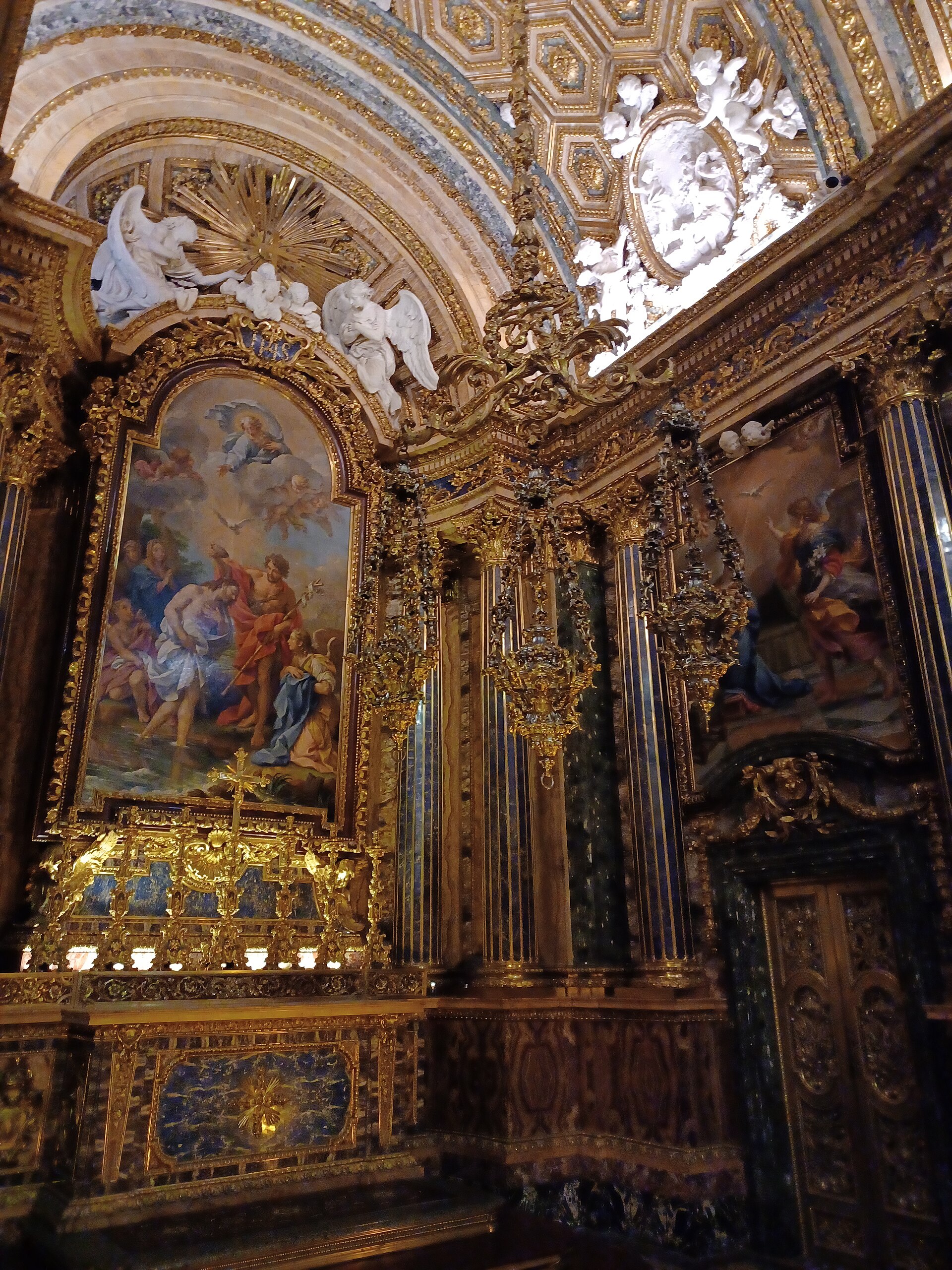 Detail of the Chapel of St John the Baptist in Sao Roque showing the mosaic Baptism of Christ and gilded columns